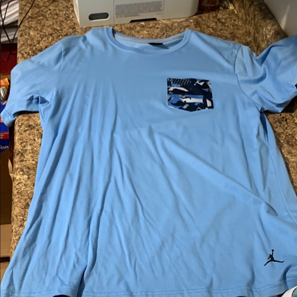 Jordan Men's Light Blue T-Shirt with Pocket. Mens size large